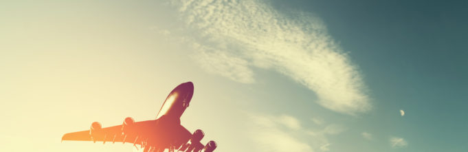 Vintage filtered photo of an airplane flying