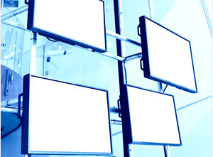 image of multiple tv screens on a wall