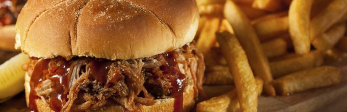Barbeque Pulled Pork Sandwich with BBQ Sauce and Fries