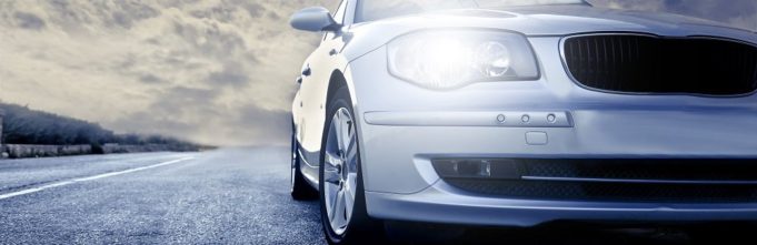 Close up of car driving on cloudy day