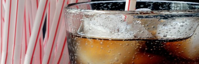 A cola with straws