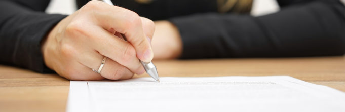 Woman writing on paper