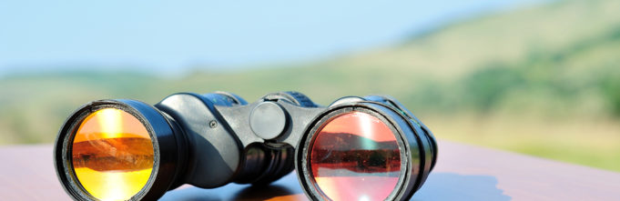 Binoculars sitting on table in daylight