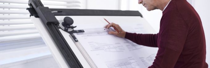 A cropped shot of a mature architect working on a building plan
