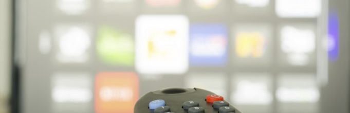 TV remote control pointed at a tv