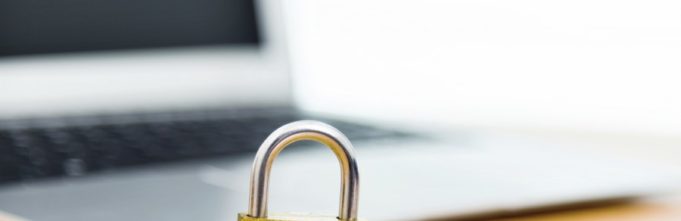 Padlock next to a laptop