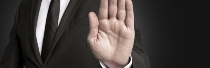 Hand stop shown by businessman