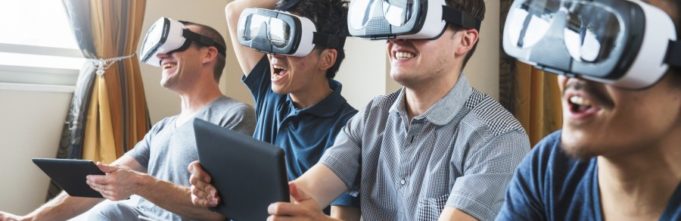 A bunch of guys playing VR games