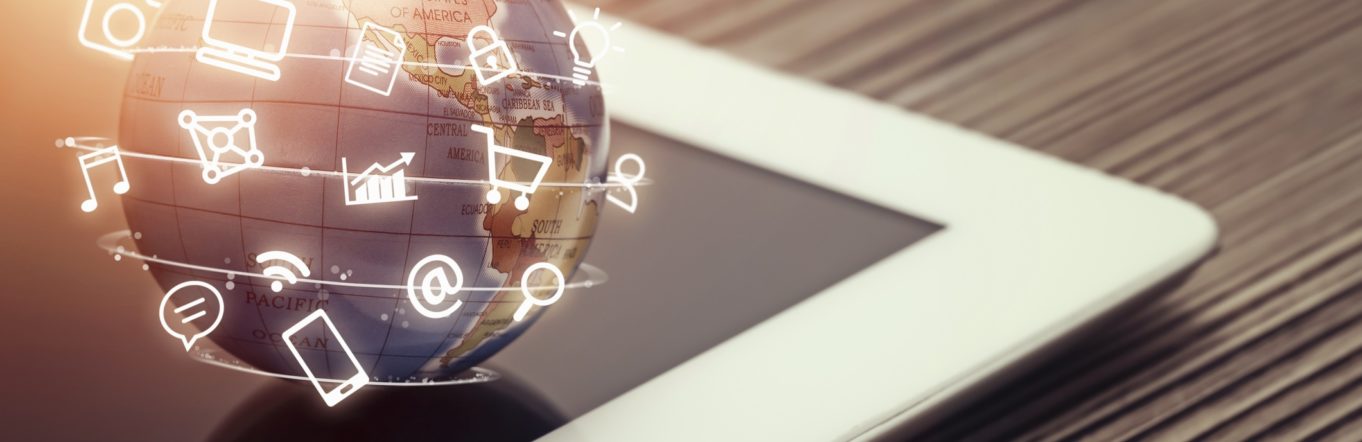 media icons fly around globe on tablet computer