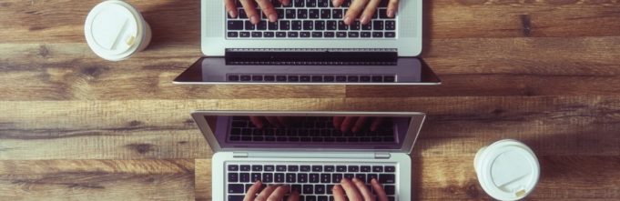 Man and woman working on campaign targeting