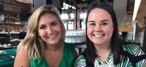 Dallas interns wearing green shirts in a bar