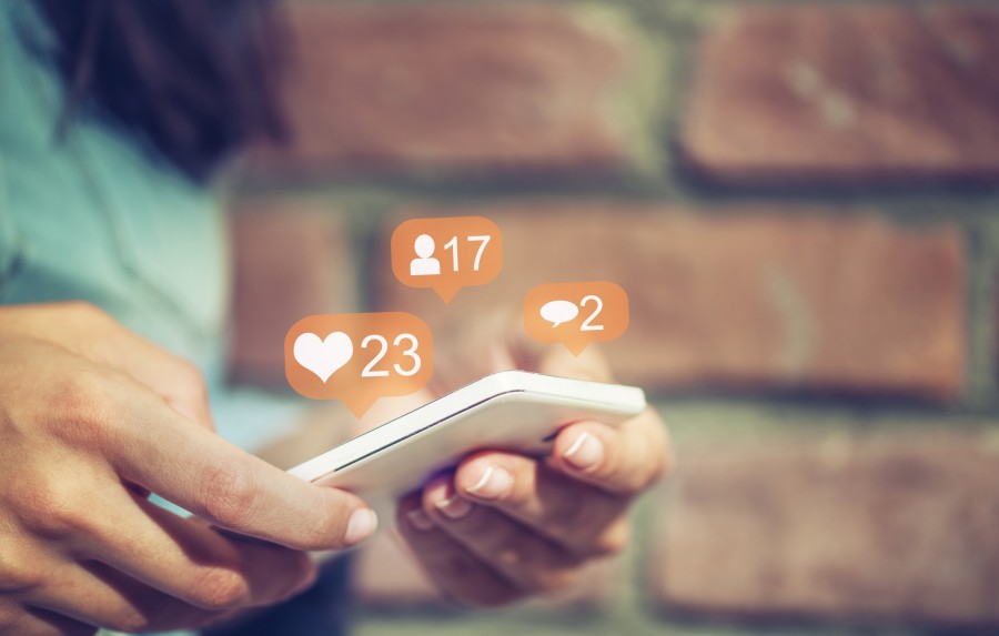 A phone with friend request, likes and comment notifications | Centro