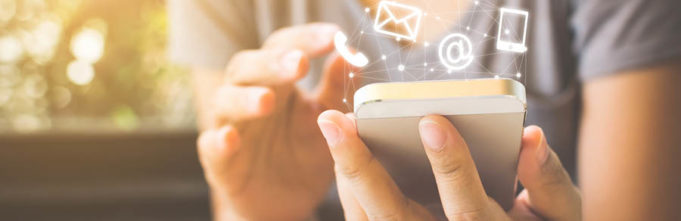 Woman with iPhone and email imagery