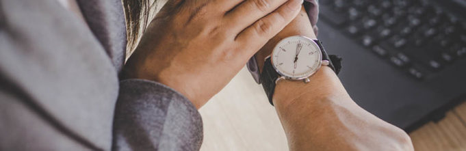 A woman checking the time on her watch