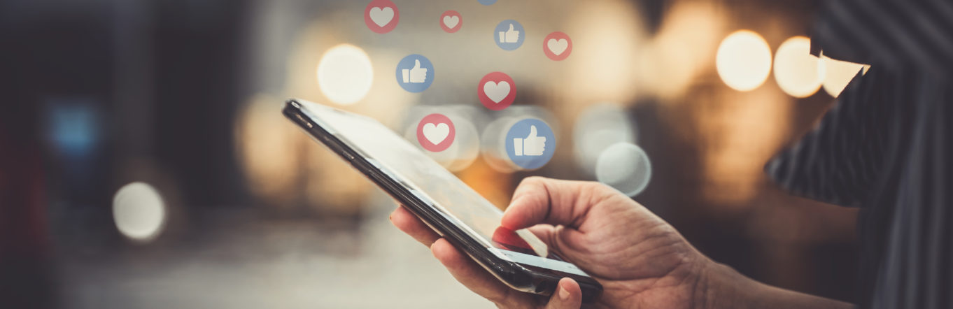 Hand using smartphone with Social media concept