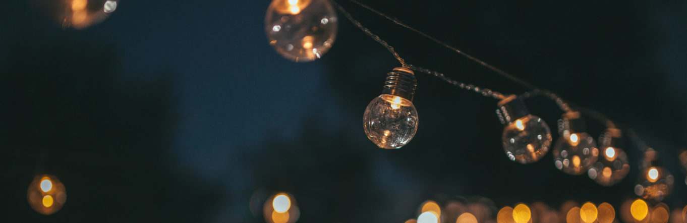Lightbulbs hanging outdoors