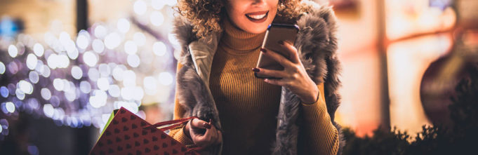 Woman shopping during the holidays using smartphone