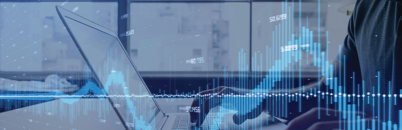 Audio waves in front of a laptop