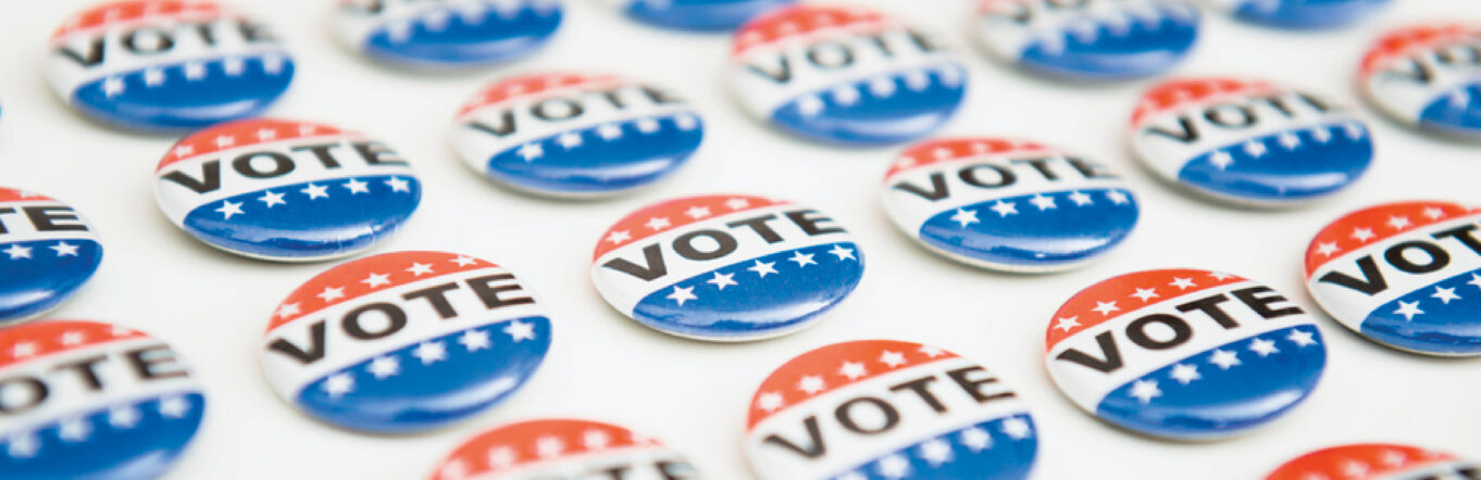 "Vote" buttons laid in a pattern on a table