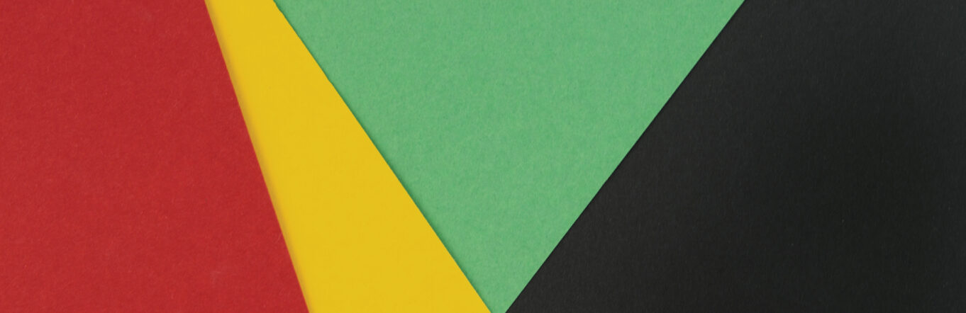 Abstract image with colored shapes in red, yellow, green, and black (black history month colors)