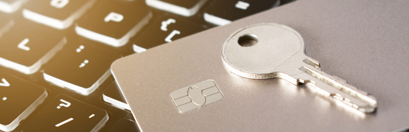 Illustration of a key and credit card on top of a laptop